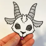 Vinyl die cut sticker of a white goat skull illustration