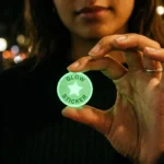 Round glow in the dark die cut sticker glowing green