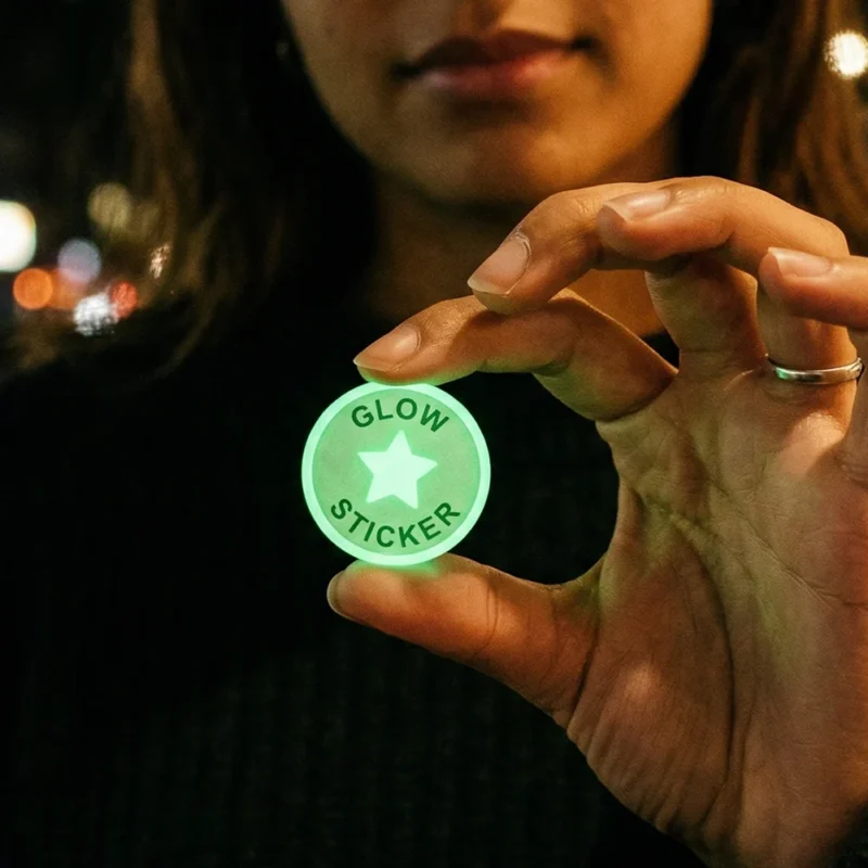 Round glow in the dark die cut sticker glowing green