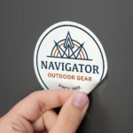 White round die cut logo sticker for Navigator Outdoor Gear