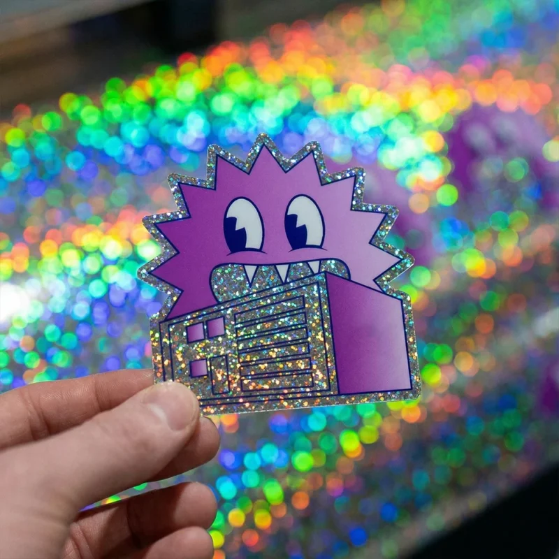 Prismatic die cut sticker of a purple cartoon character